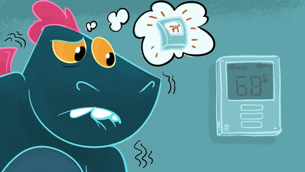 Toestie the Dragon looks at the thermostat dreaming of warmer temperatures