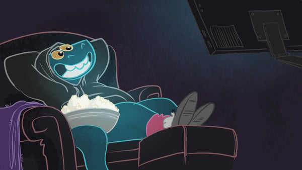 Toestie relaxes on a comfy chair with a big bowl of popcorn beside him