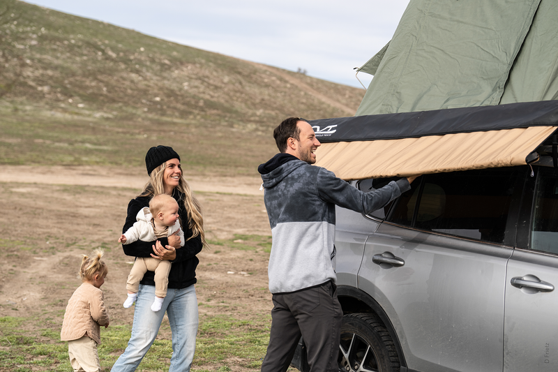 A family sets up their winter camping site. |Heat Holders®