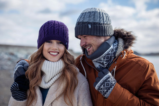 Affectionate couple wearing Heat Holders® thermal accessories