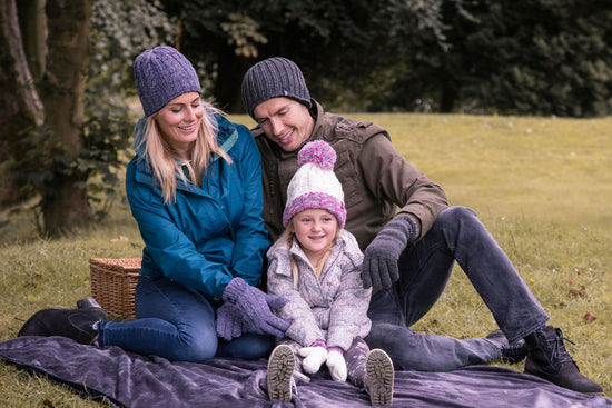 Family having a picnic, wearing Heat Holders® thermal socks and accessories